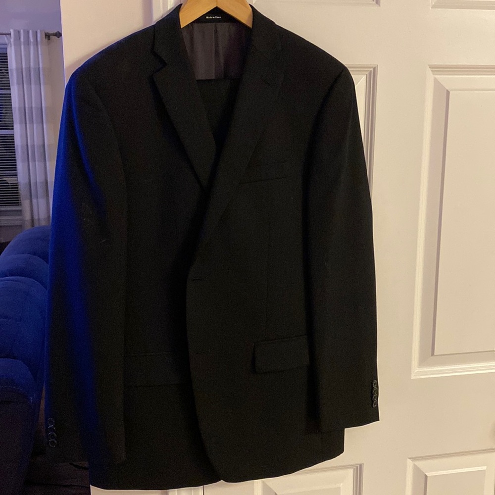 Mens suit, black with faint grey pinstripe.